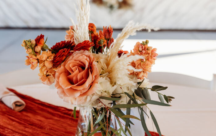 Reception tables with romantic desert-inspired centerpieces