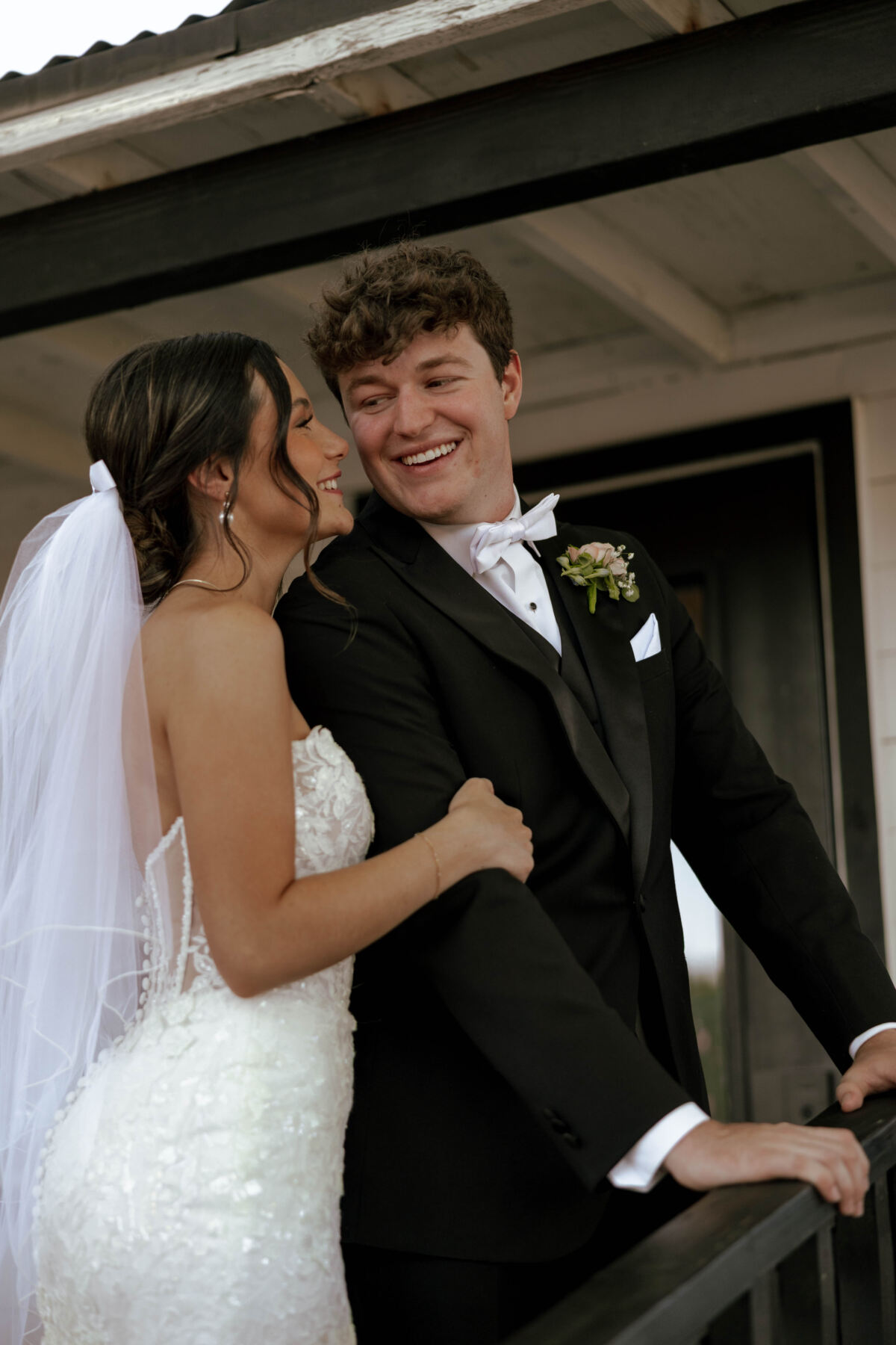 Fortenberry Wedding bride and groom posing on the bridal suite steps