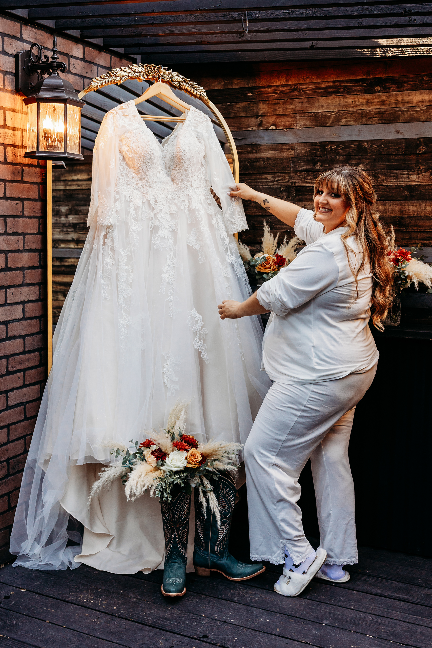 Bride getting ready with bridesmaids enjoying champagne in bridal suite at The Venue at Chilleens