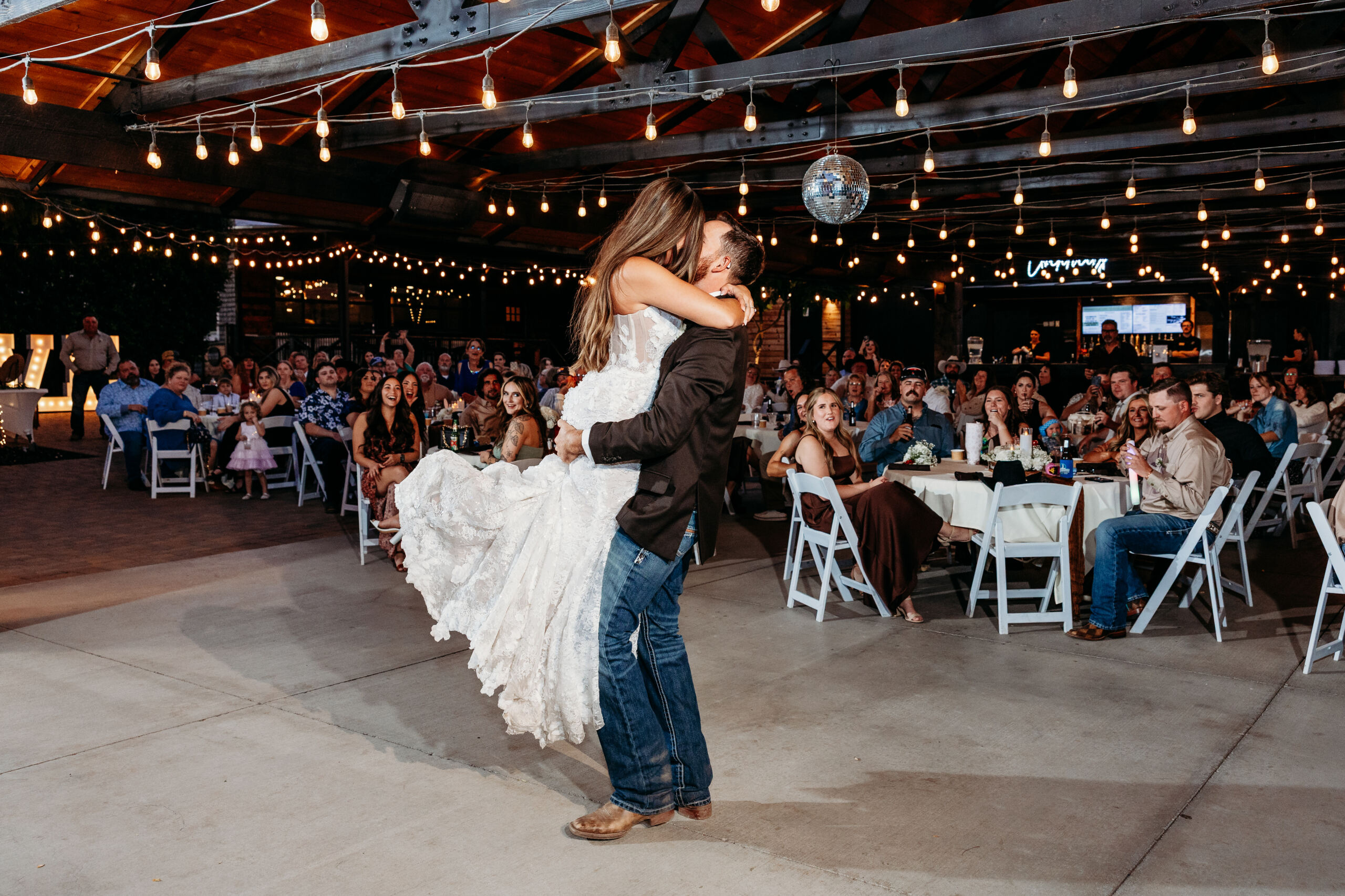 First dance with friends and family happily watching